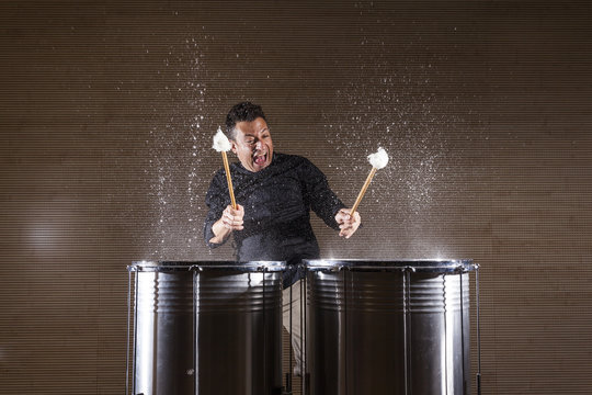 Percussionist Practicing With Two Drums