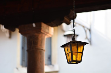 An old chandelier for street lighting of an Italian city.