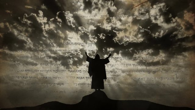 Silhouette of Jesus praying on hill. Ink transition animation effect with text of the old prophecy.