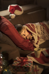 Boy waiting for Santa on Christmas eve