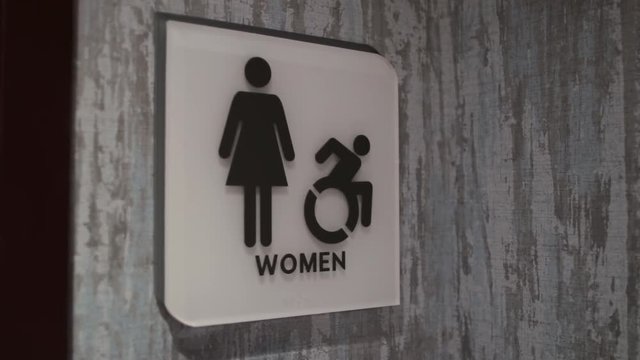 Womans restroom sign move in.mov