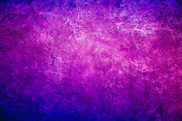 Texture background image of a wall with purple blue metallic shining plaster.