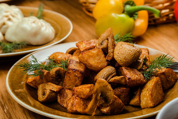 Homemade Food: Potatoes with mushrooms closeup. horizontal view from above