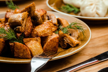 Homemade Food: Potatoes with mushrooms closeup. horizontal view from above