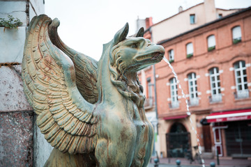 Hieratic griffon statue of the Dupuy Monument at Place Dupuy in Toulouse France