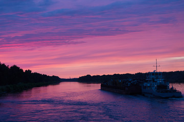 Big barge on the Volga at sunset