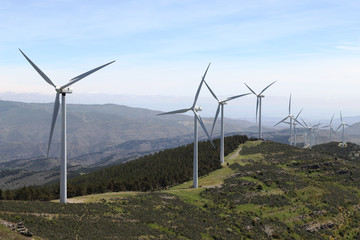 WIND TURBINE PARK WITH WIND GENERATORS IN THE HIGH OF A HILL 