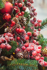 Christmas tree with red and golden flower decors interiors. Xmas. Close up.