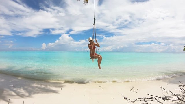 Girl Swinging on a Swing on Maldives, 4K.