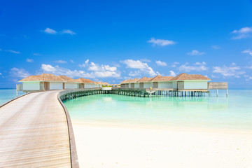 Fototapeta na wymiar Tropical Water villas on Maldives island in the morning, holiday vacation background concept