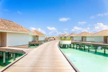 Fototapeta na wymiar Tropical Water villas on Maldives island, holiday vacation background concept
