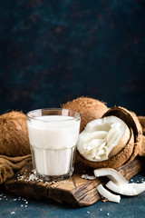 Fresh coconut milk in glass, vegan non dairy healthy drink