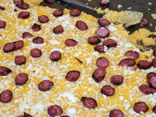 Polenta with cheese and sausages. Romanian traditional food, mamaliga.