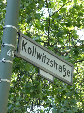 Kollwitzstrasse street name sign. The street, in Prenzlauer Berg district, is named to Käthe Kollwitz, a German artist, who worked with painting, printmaking and sculpture