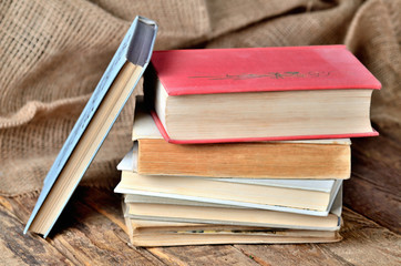 Old, vintage books on a rustic wooden table