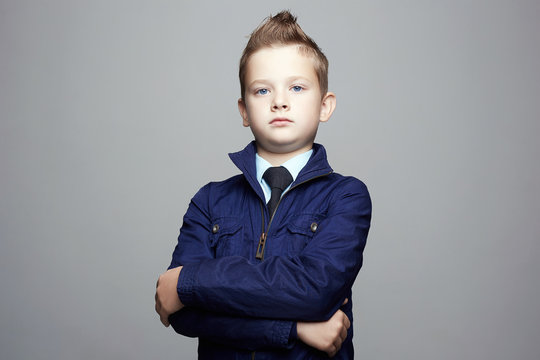 Fashion Hairstyle Child Portrait. Elegant Kid In Tie