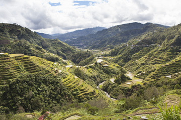 Banaue rice fields, Ifugao Province, Philippines; One of the oldest rice fields in the world - People of seasoned warriors and wood carvers, formerly head cutters, the Ifugaos perpetuate today as best they can their traditions and beliefs. Because defores