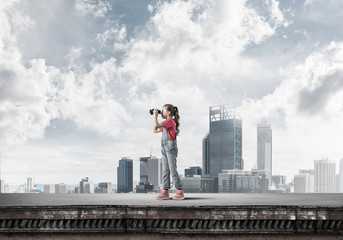 Concept of careless happy childhood with girl of school age look
