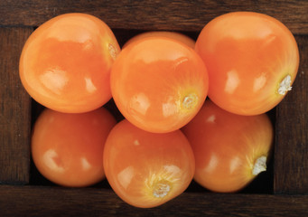 heap of physalis in wooden box
