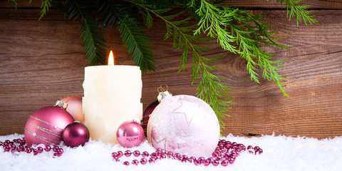 candle in snow christmas background