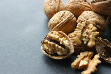 Walnuts close-up on wooden table. Healthy food, healthy lifestyle, diet, vegetarianism.