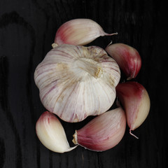 heap of garlic in wooden background