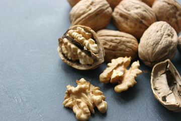Walnuts close-up on wooden table. Healthy food, healthy lifestyle, diet, vegetarianism.