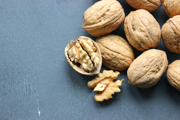 Walnuts close-up on wooden table. Healthy food, healthy lifestyle, diet, vegetarianism.