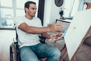 Portrait of Disabled Young Man Painting Picture