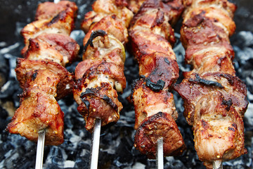 Meat roasted on fire barbecue grill