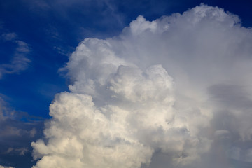 Naklejka na ściany i meble White creamy clouds in the sky as a background