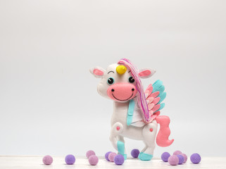 children's toy horse made of felt on a white background