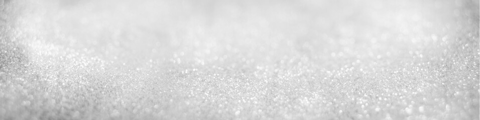 Abstract of Bright and sparkling bokeh background. silver and diamond dust bokeh blurred lighting from glitter texture