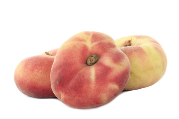 heap of flat peachs isolated