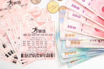 Taipei, Taiwan - 7 Oct 2018: Closeup of Taiwanese currency & Taiwan lottery tickets: Big Lotto.