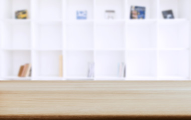 Selected focus empty old wooden table and .Library or Bookstore blur background with bokeh image. for your photomontage or product display