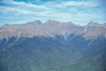Fototapeta premium Mountain landscape in the afternoon, rocks in the background