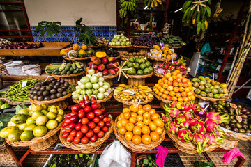 Many fresh and ripe exotic fruits on traditional farmer market Mercado dos Lavradores, Funchal,...