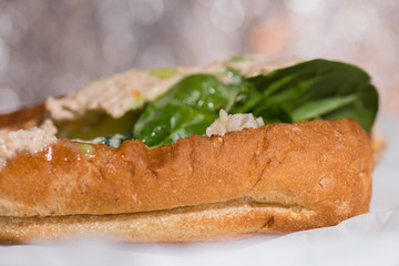 Closeup fresh sandwich with tuna and vegetables.