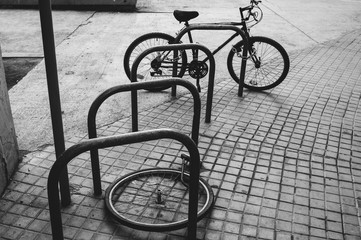 Fototapeta na wymiar Bicycle wheel with locker on the street