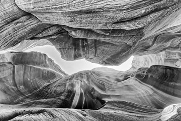 Beautiful wide angle view of amazing sandstone formations in famous Antelope Canyon, bottom-up skyward view