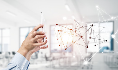 Business and technology concept with networking grid and man usi