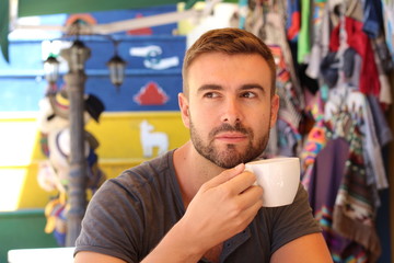 Fototapeta premium Attractive man enjoying a cup of coffee
