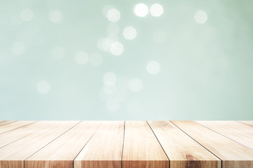 Wooden table with mint  bokeh abstract background.