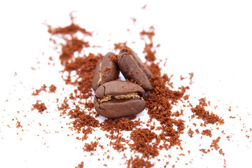 Coffee beans arranged on a white background as texture with copy space
