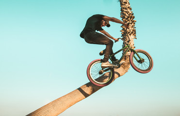 Young man with a bmx bike around the city. BMX freestyle