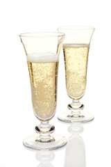 Glasses with champagne on a white background.