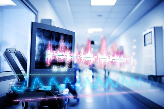 Medical Technology Concept With A Hologram Of Curves And Graphs Of Data On The Background Of The Equipment Inside The Hospital