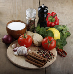 vegetables and spices on wooden background