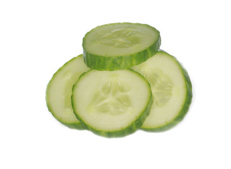 heap of slices of cucumber isolated on white